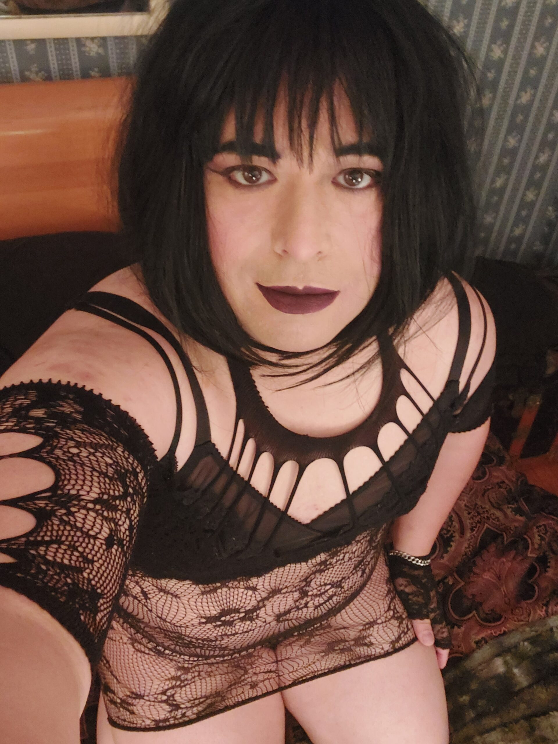 Mistress is look up into a camera.
