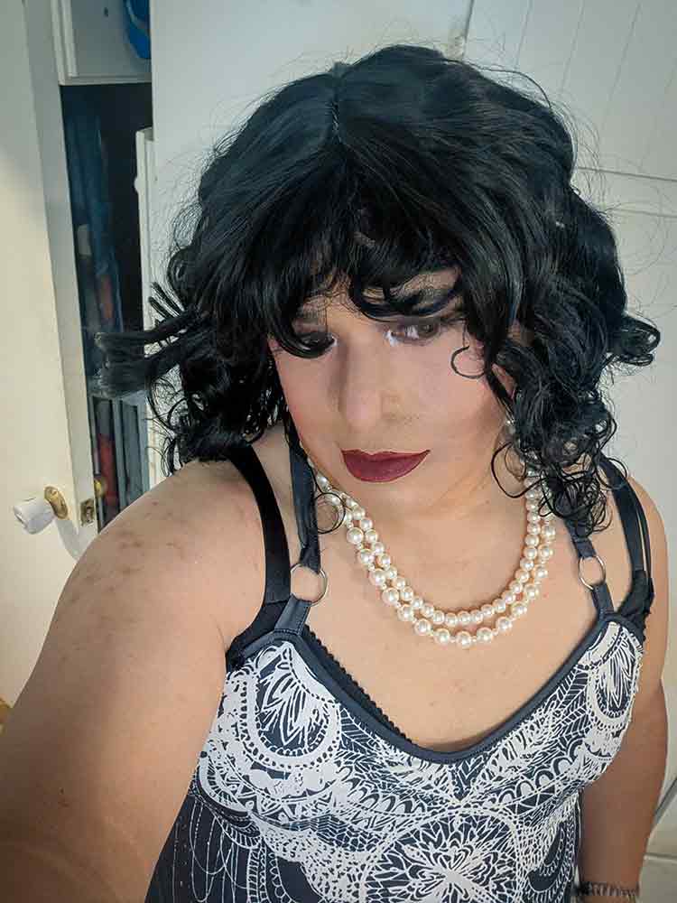Mistress is looking away from the camera.