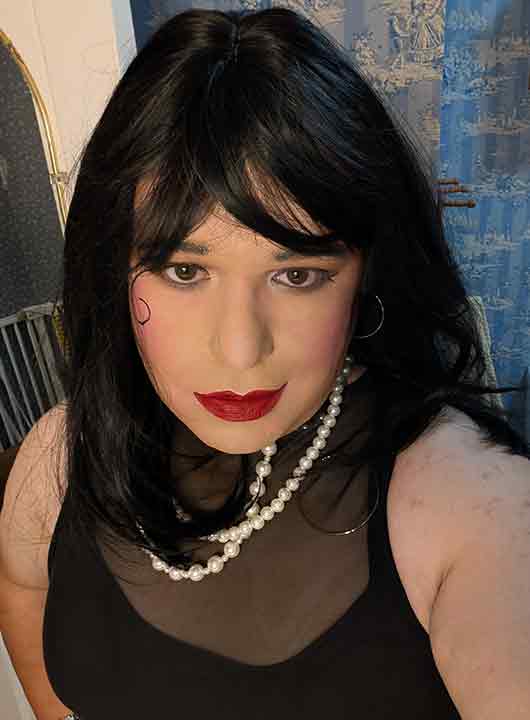 Mistress is looking at the camera.