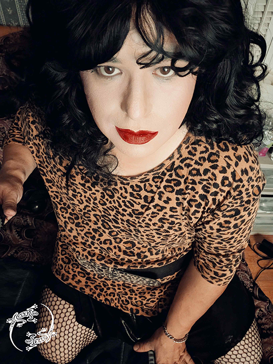 Mistress is looking up into the camera. 