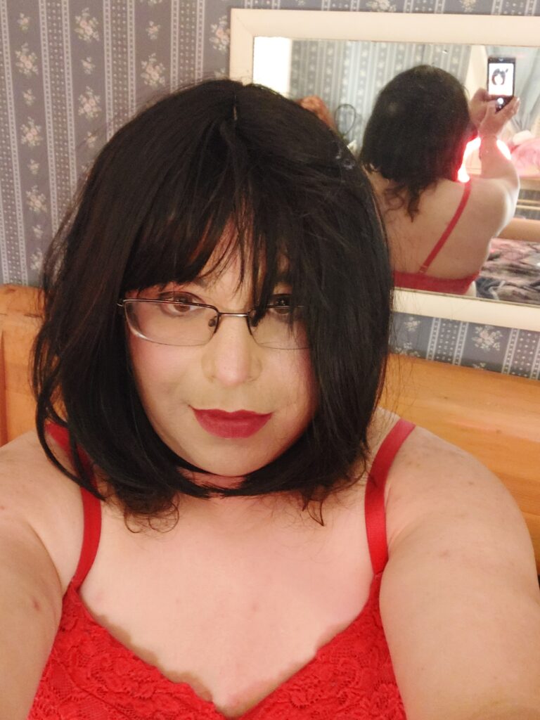 Mistress is wearing glass and a bra.