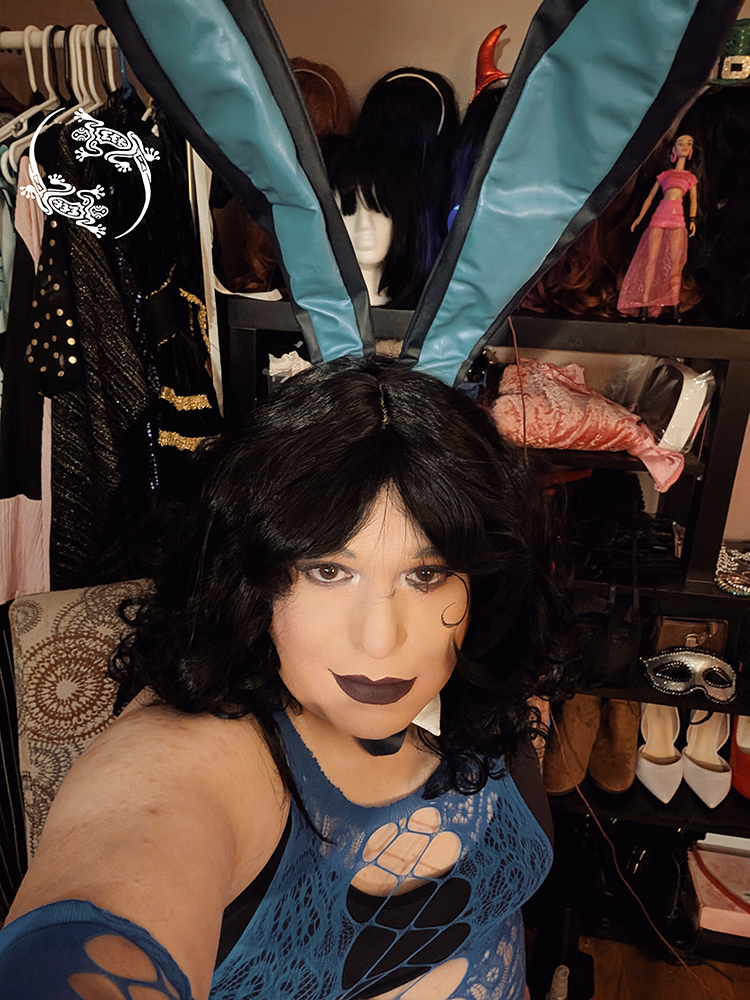 Mistress Ilya is wearing bunny ears while taking a selfie.