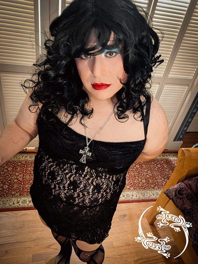 Mistress Ilya is looking up into the camera.