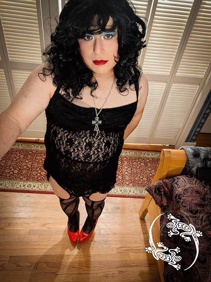 Mistress is wearing heels and taking a selfie.