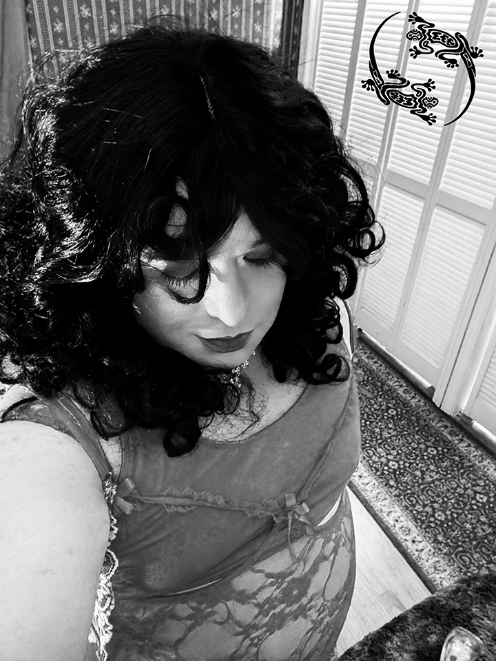 Mistress Ilya is looking down. 