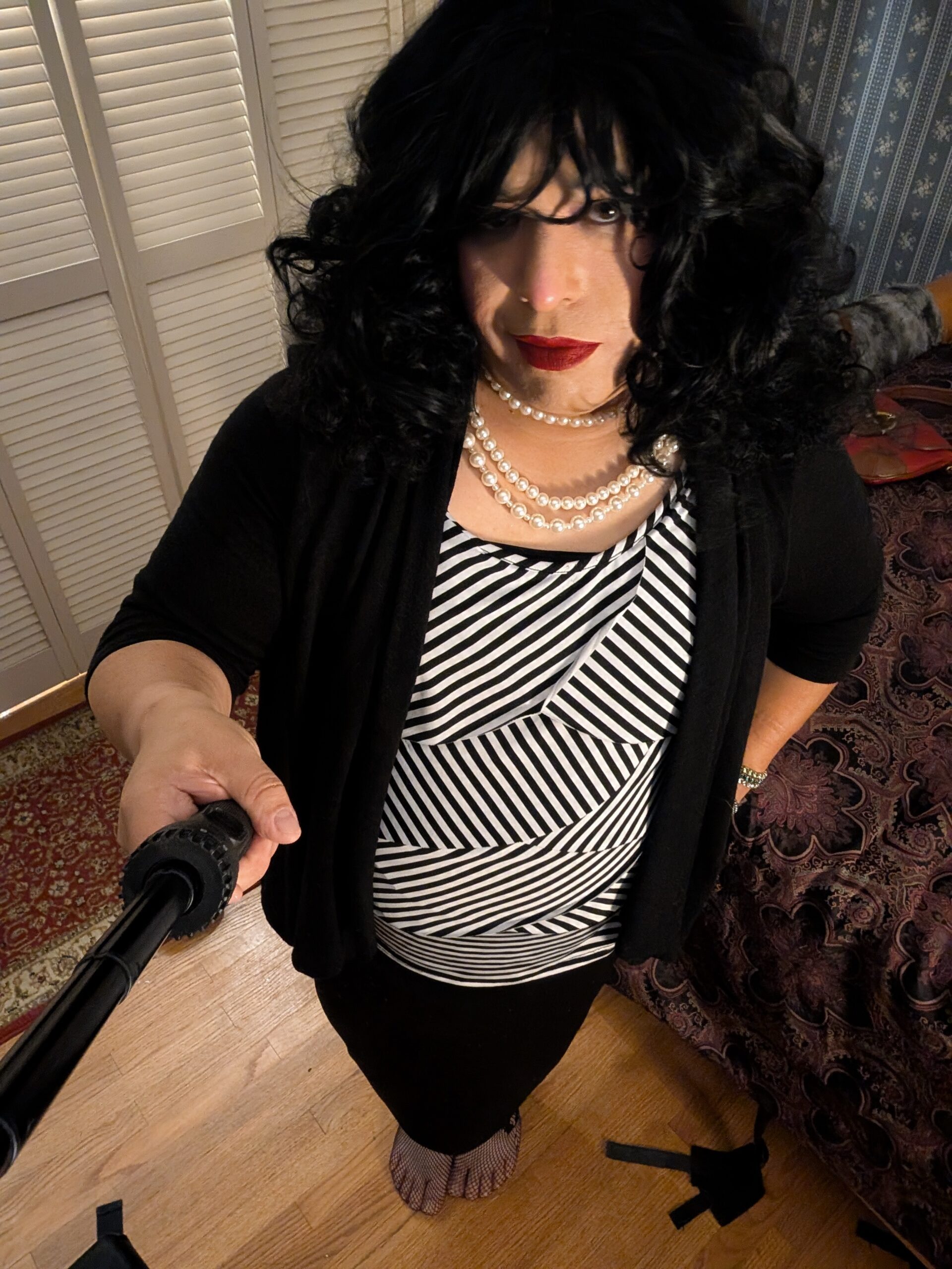 Mistress Ilya is taking a selfie.