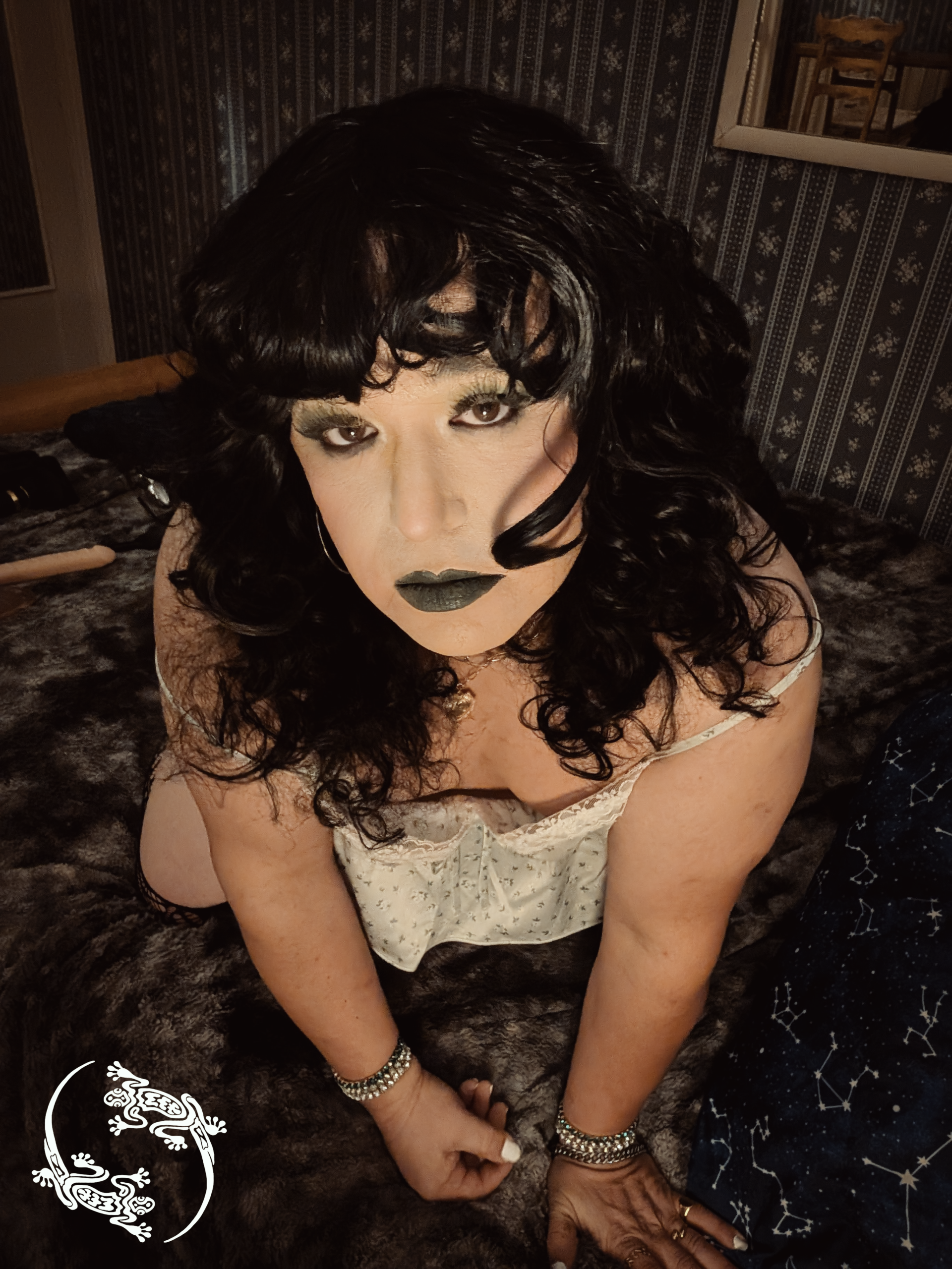 Mistress Ilya is looking coy while on her hands and knees.