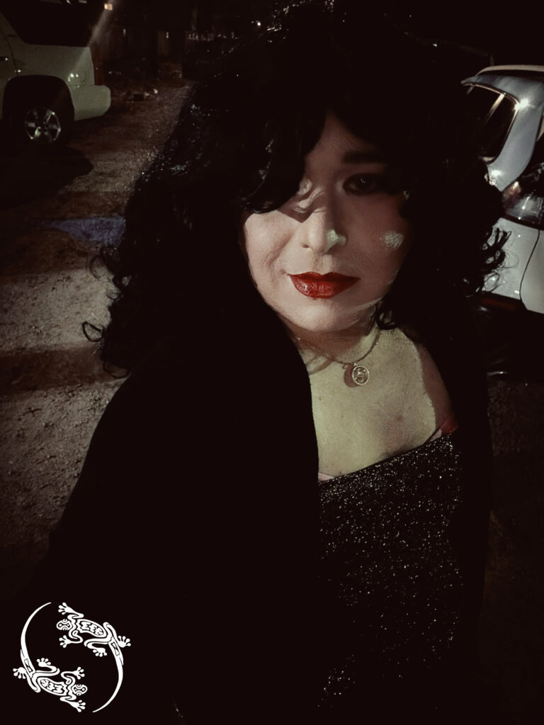 Mistress Ilya is outside taking a selfie.